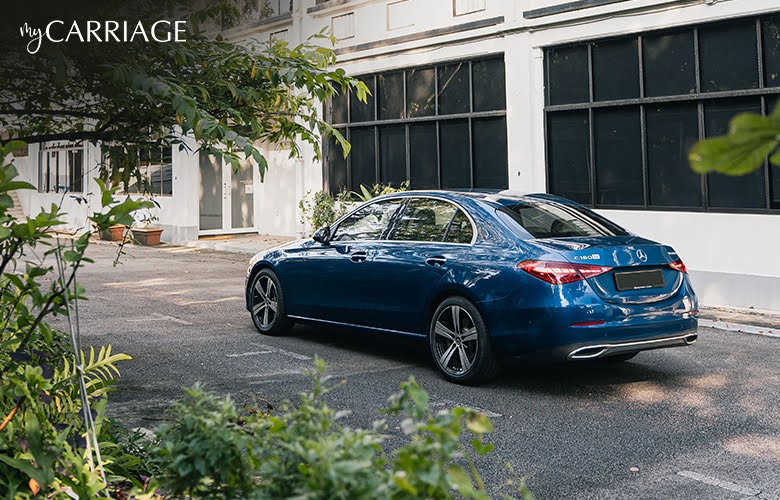 Blue rental car on the road